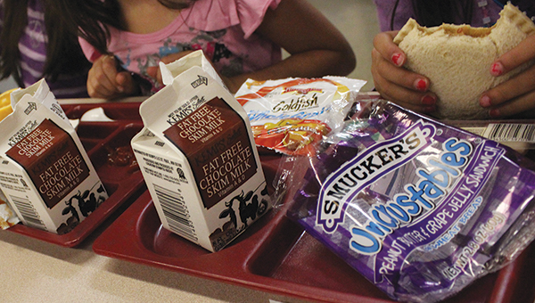 Kindergartners eat lunch at Sumner Elementary School Monday.
